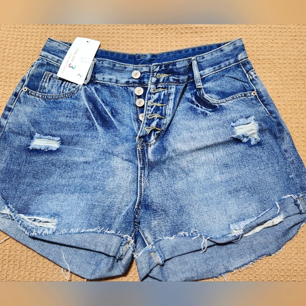 Woman's distressed Jean shorts with button fly sz L